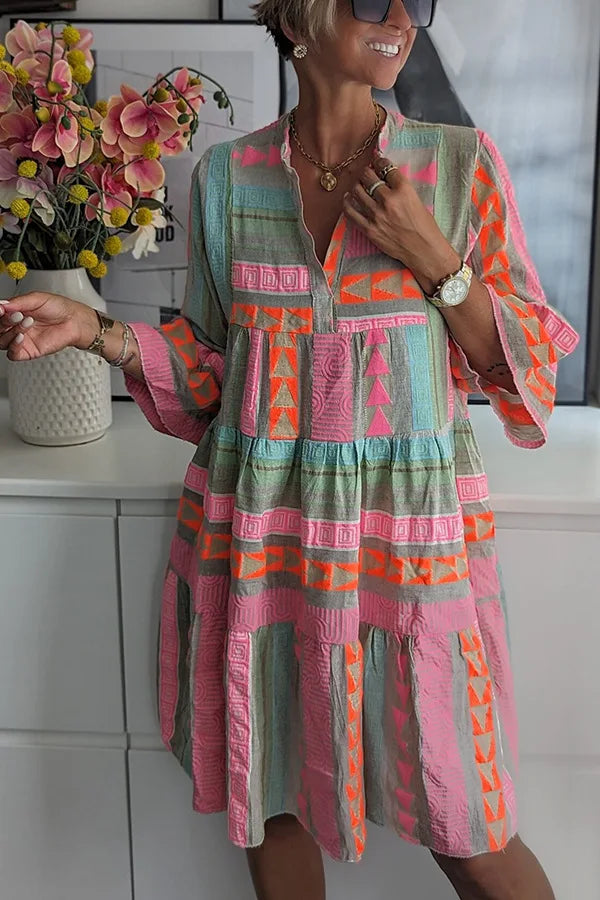 Chloe Lunara tiered dress in coral and sage print, three-quarter view