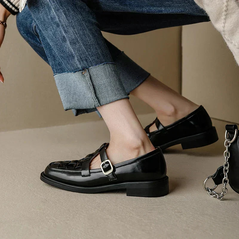 Isava retro flats in black, side view worn with turned-up jeans