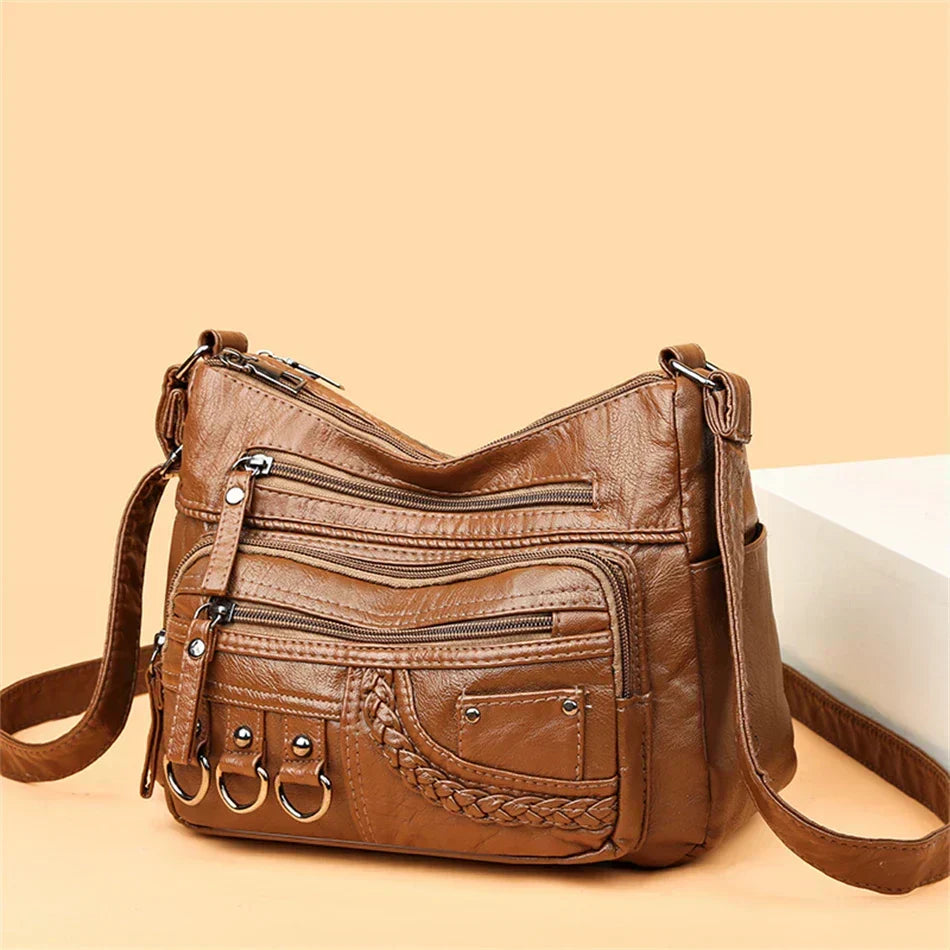 Olivia brown shoulder bag, three-quarter view with ring details