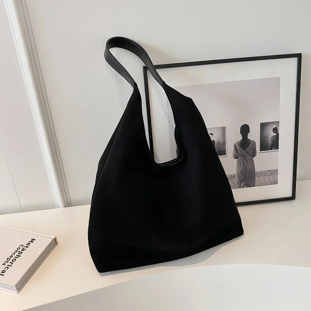 Ottilie shoulder bag in black suede, front view