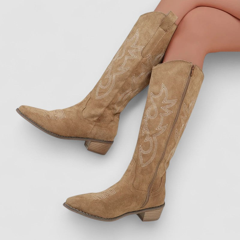 Cornelia western boots in beige, seated side view