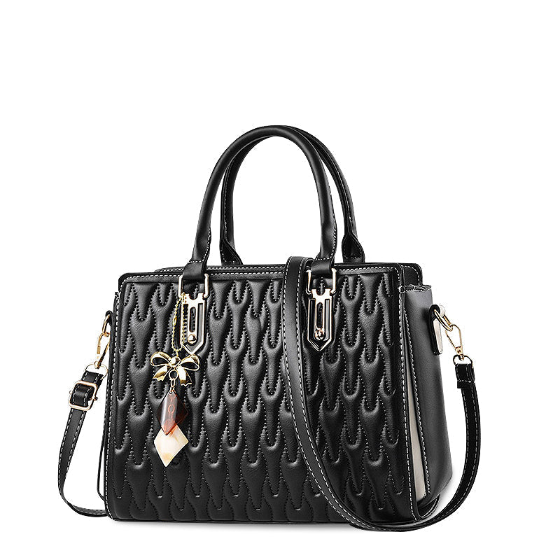 Vellora shoulder handbag in black, angled view with shoulder strap