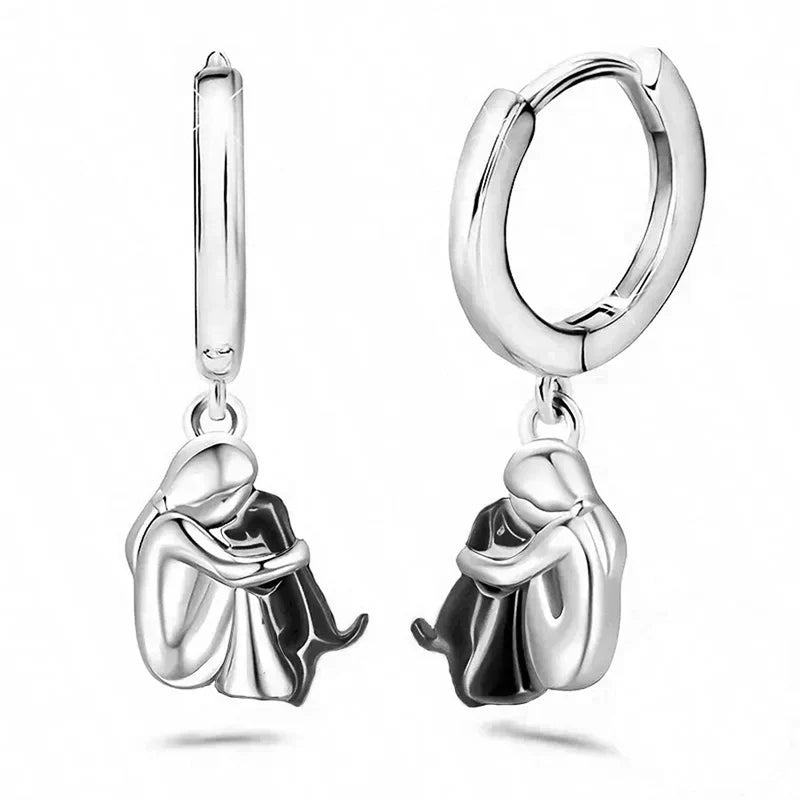 Seleno dog icon earrings in black and silver, pair shown upright