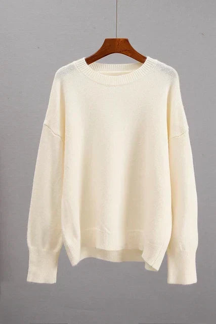 Alice cashmere sweater in cream, shown on a hanger