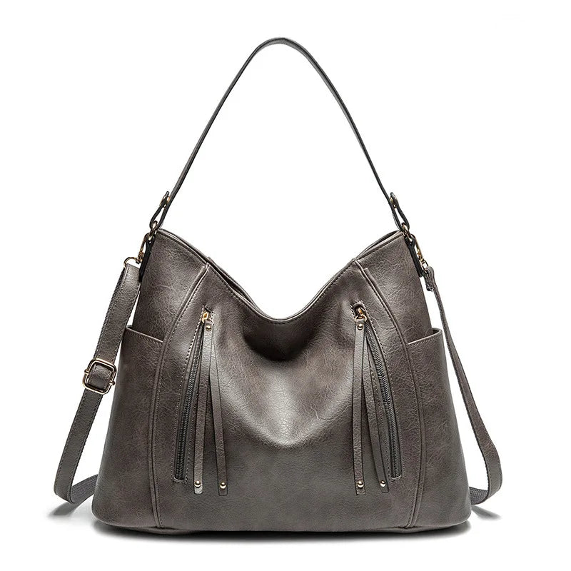 Calista luxe shoulder bag in grey, front view with side pockets