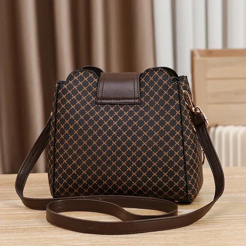 Marjorie charm bag in coffee, back view with long strap