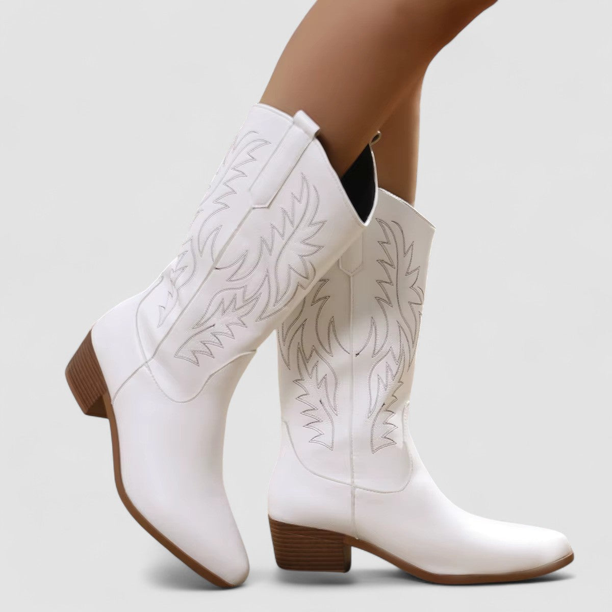 Sierra embroidered western boots in white, side view on model