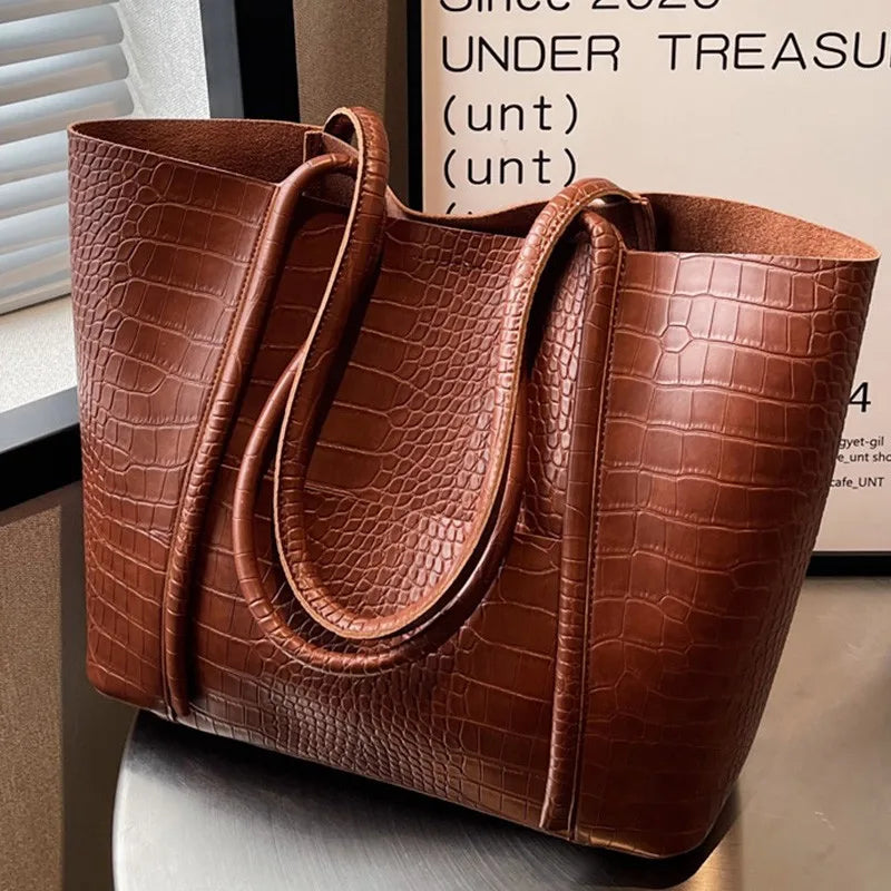 Sylvette croc shoulder bag in brown, front view