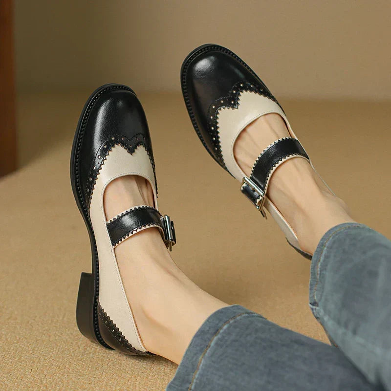 Lumerra Mary Janes in black and cream, worn with jeans