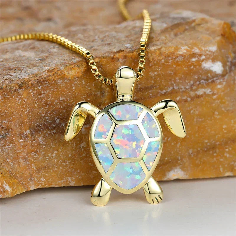 Opal turtle pendant necklace in gold tone with white shell panels