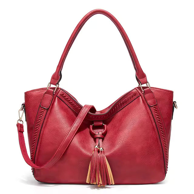 Elowen premium leather tote bag in red, front view with shoulder strap