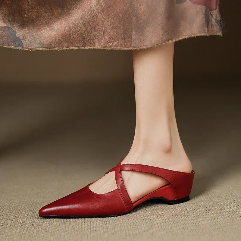 Aluna pointed-toe leather mules in maroon, side view on model
