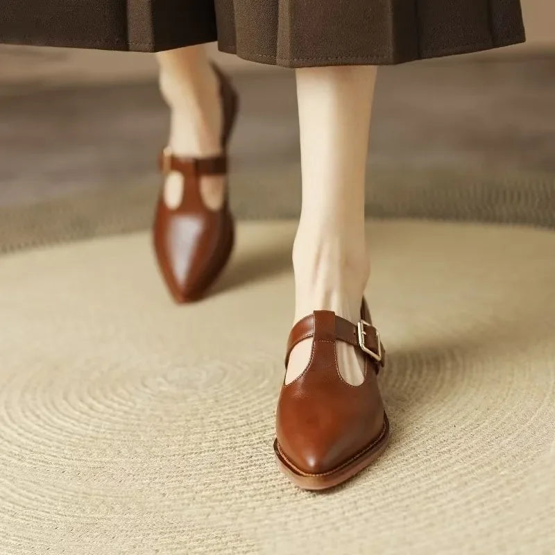 Leomara pointed T-strap heels in brown, worn walking view