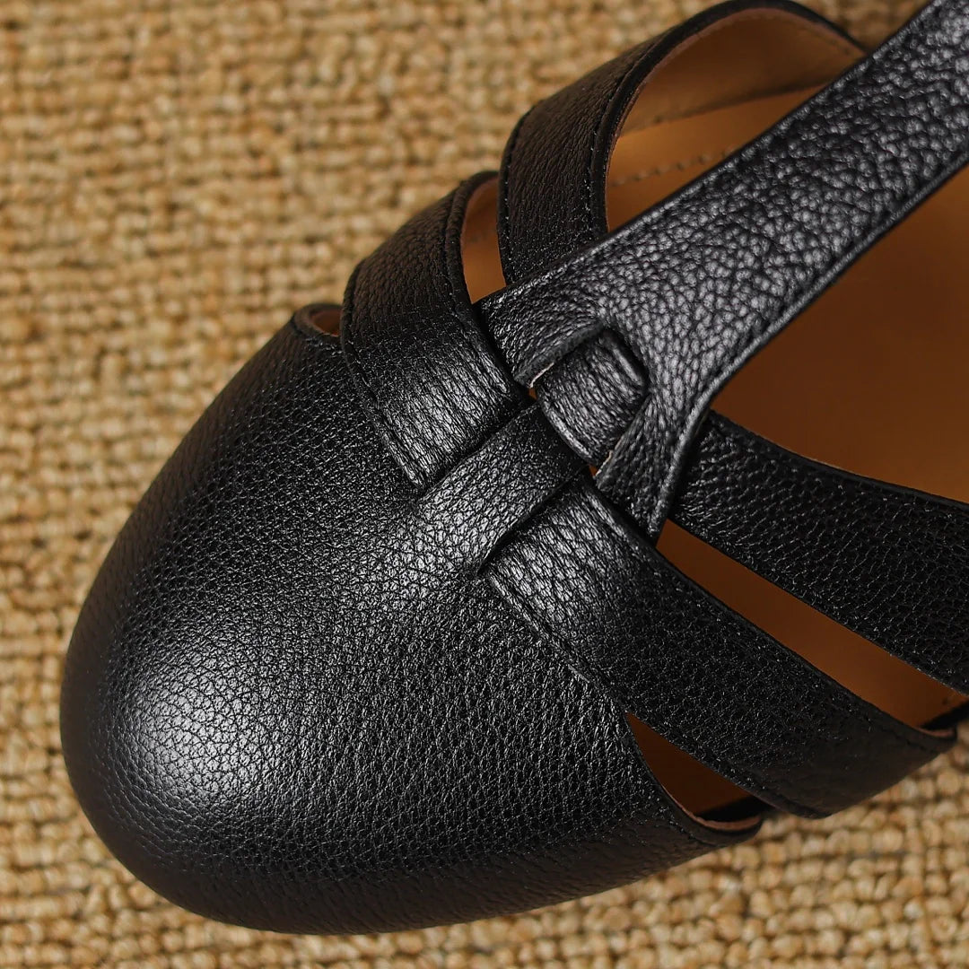 Joan T-bar flats in black, close-up of woven front straps