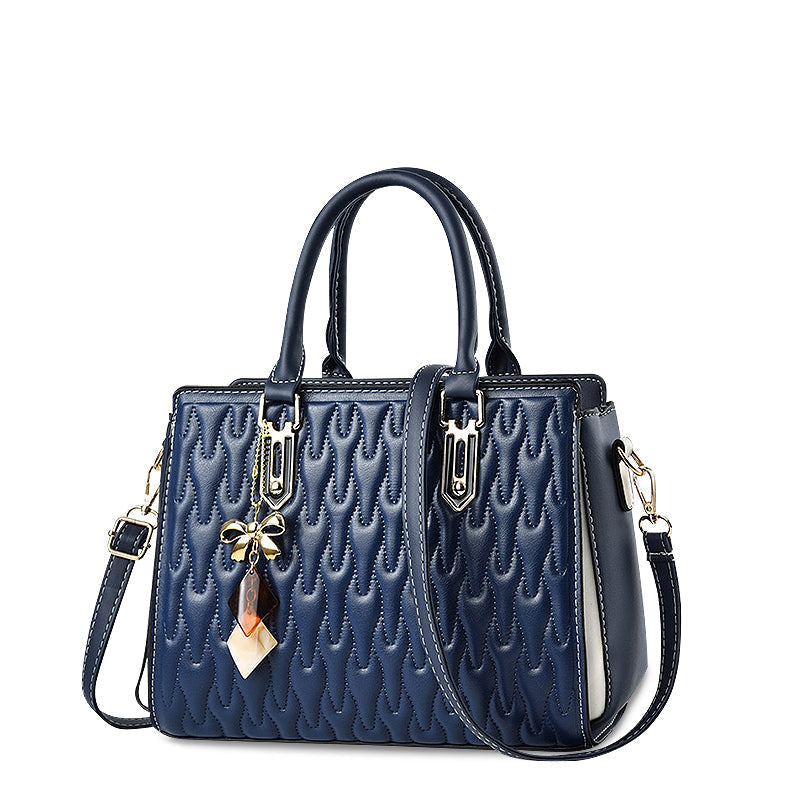 Vellora shoulder handbag in navy blue, angled front view