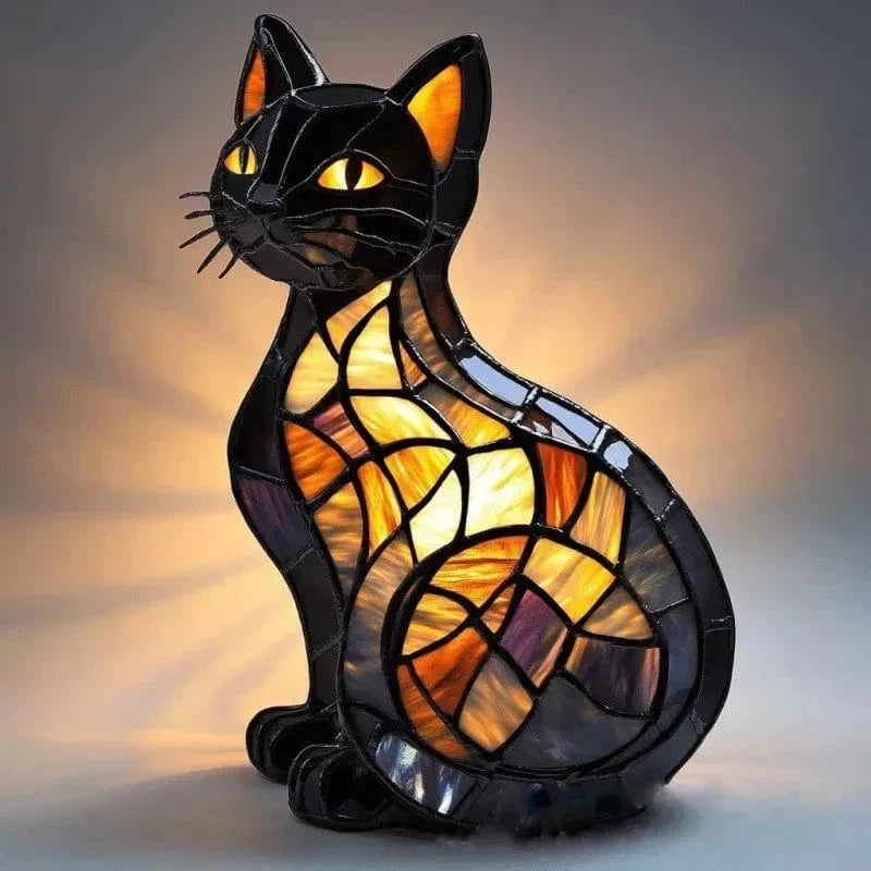 Midnight cat lamp in black resin with amber stained-glass panels, lit front view