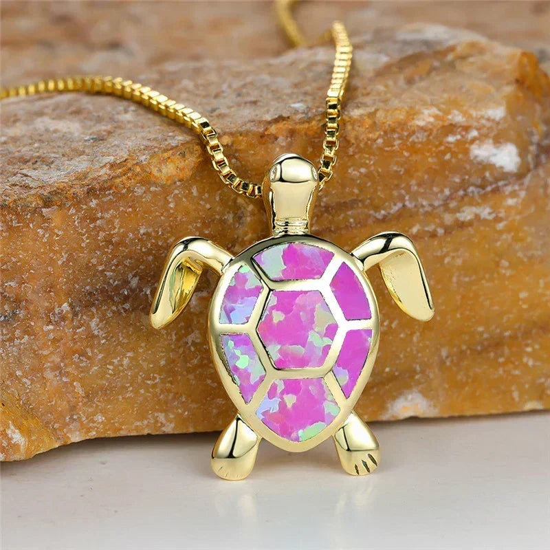 Opal turtle pendant necklace in gold tone with pink shell panels
