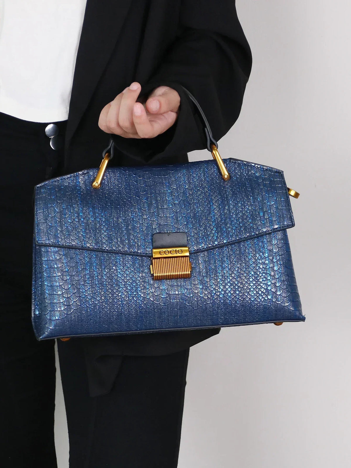 Selene python tote bag in royal blue, front view with gold lock
