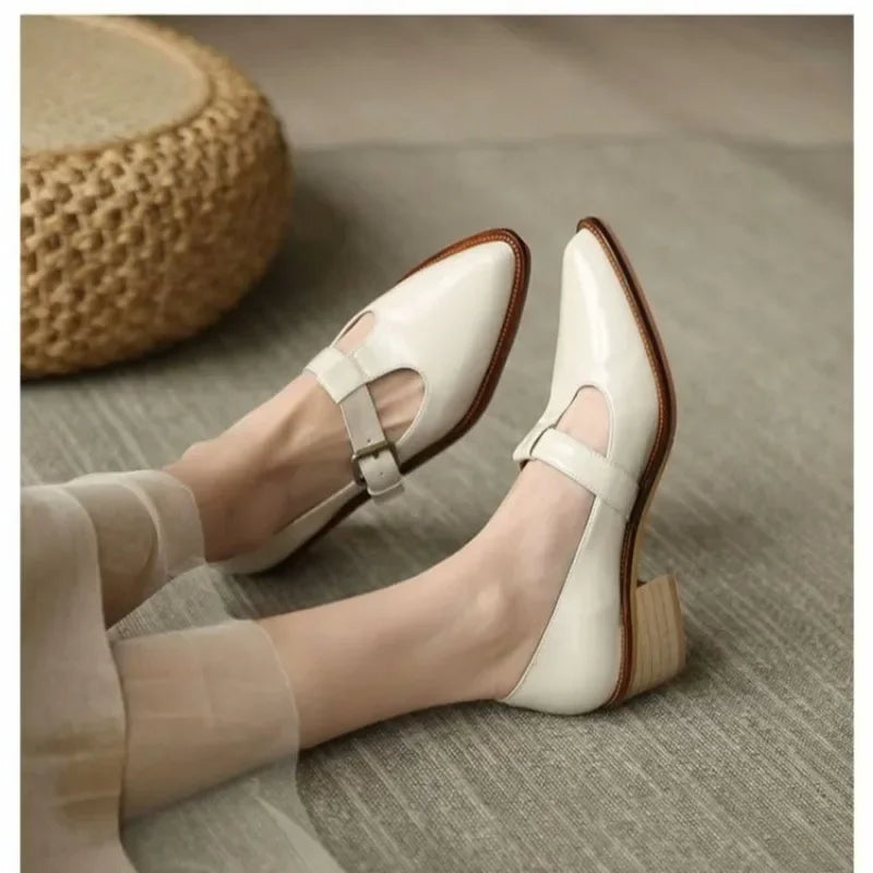 Leomara pointed T-strap heels in beige, angled side view
