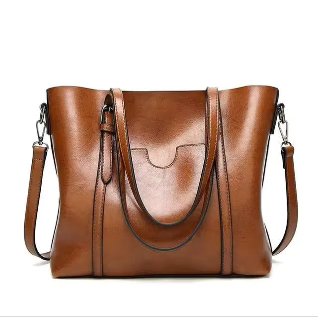 Daphira sleek shoulder bag in brown, front view with twin handles