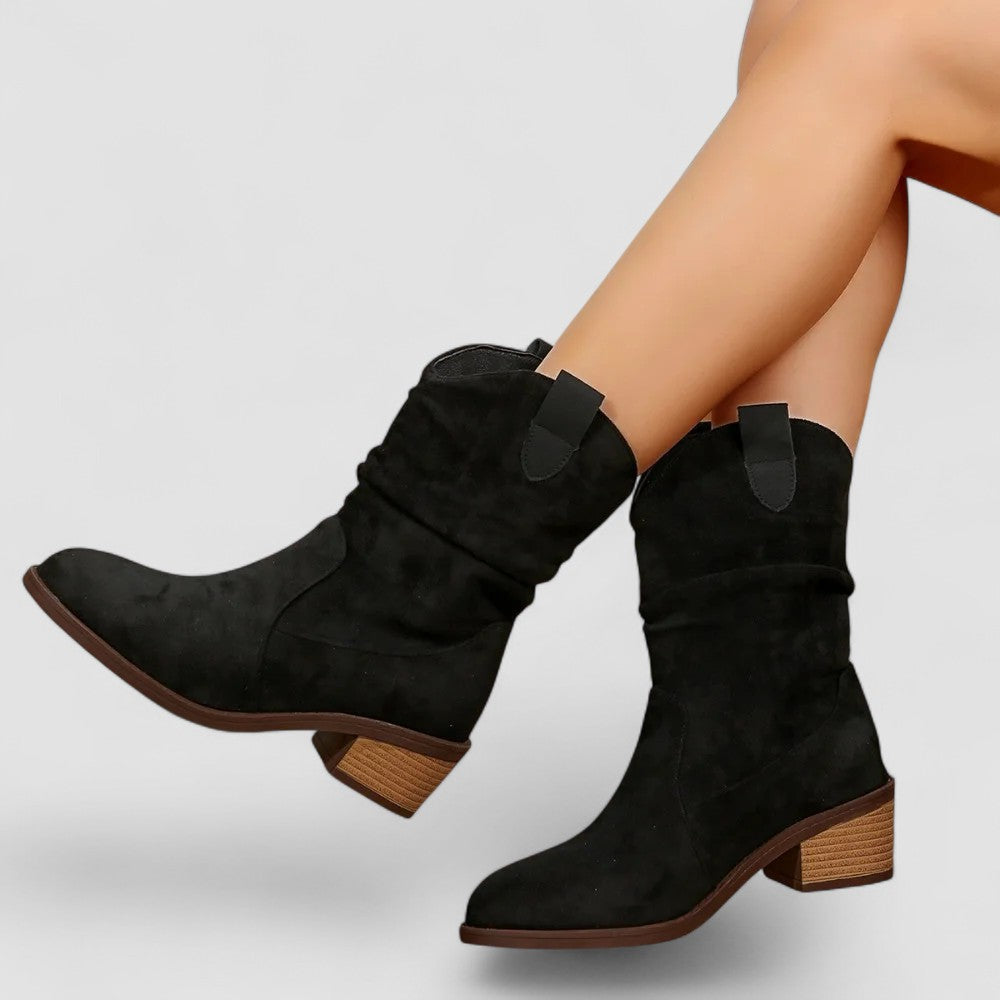 Cleo slouch western ankle boots in black, worn side view