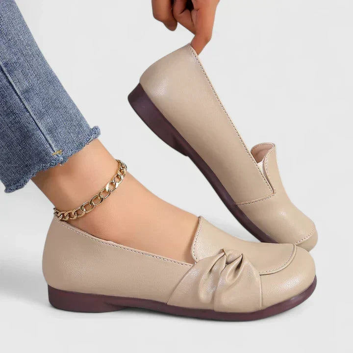 Lillian slip-on flat shoes in beige, worn side and back view
