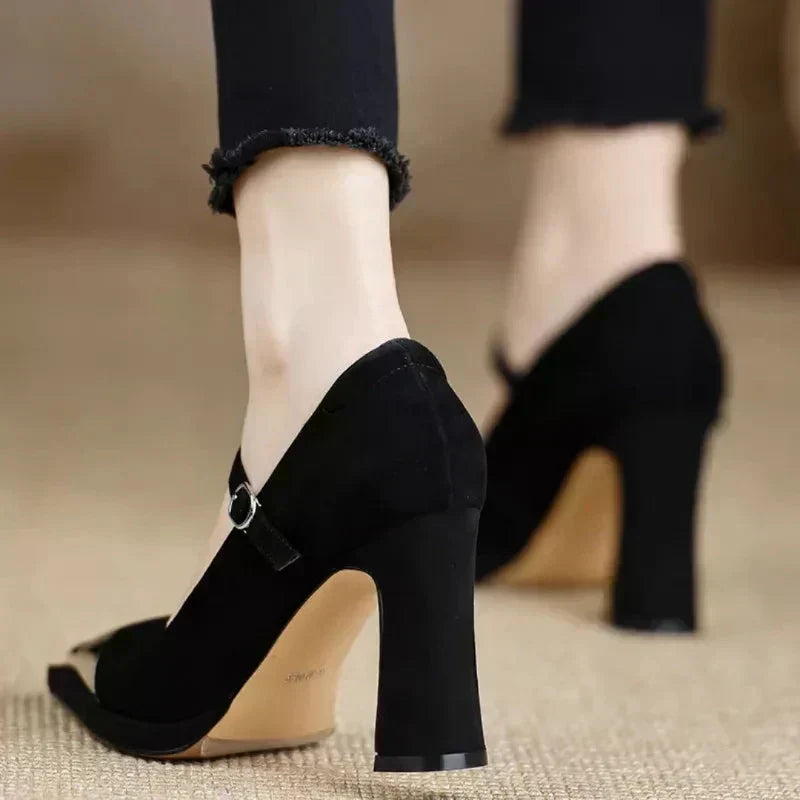 Orvanna Mary Jane heels in black, back view of block heel