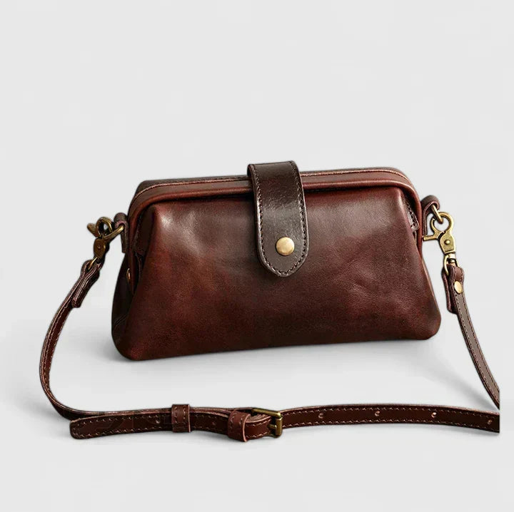 Isola structured leather shoulder bag in coffee brown, front view with strap