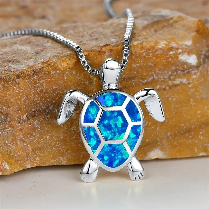 Opal turtle pendant necklace in silver tone with blue shell panels
