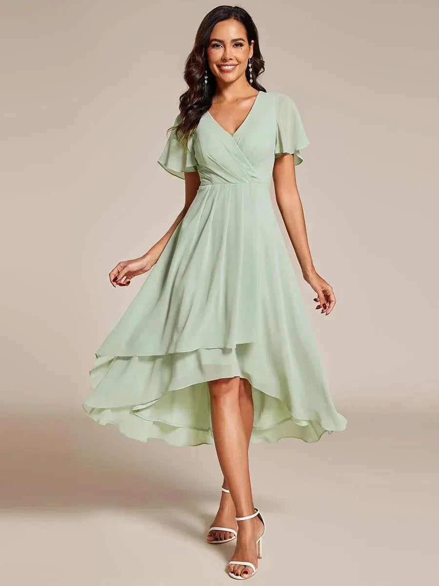 Ismey elegant flowing dress in light green, full-length front view
