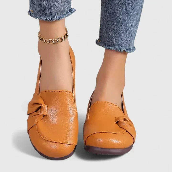 Lillian slip-on flat shoes in orange, worn front view