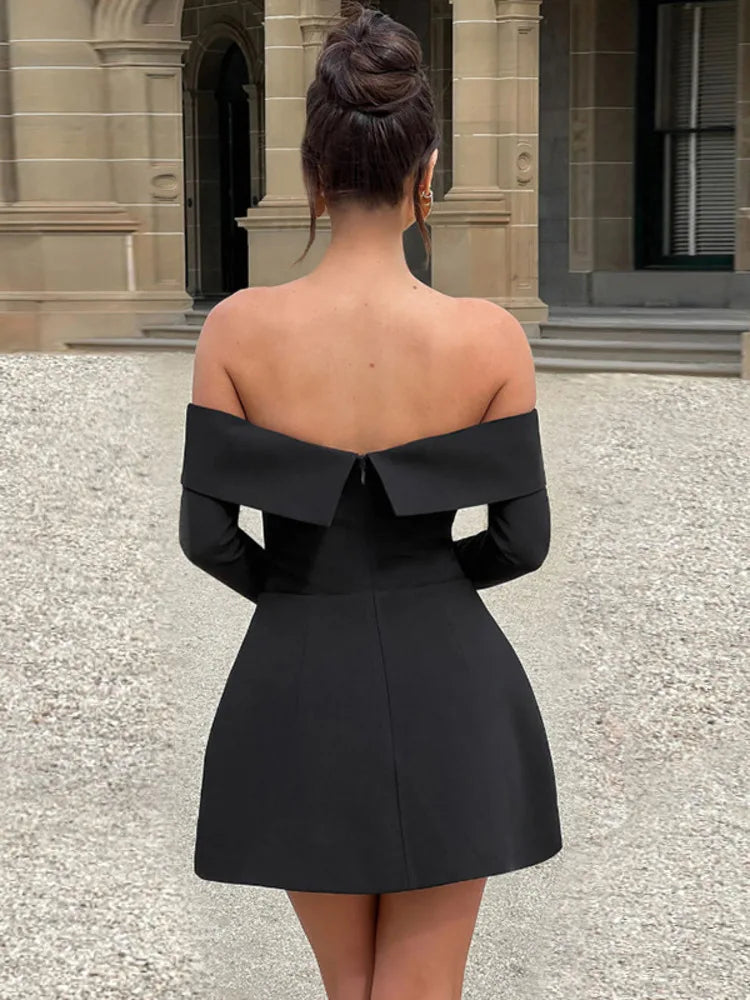 Nyra skater dress in black, back view of flared mini skirt