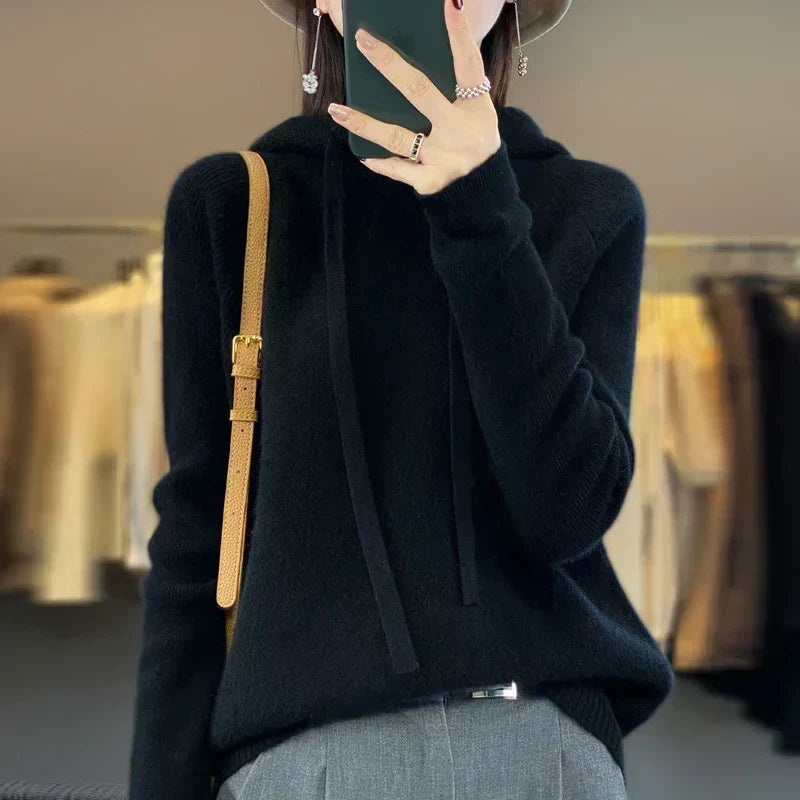 Rynlei hooded knit sweater in black, styled with grey trousers