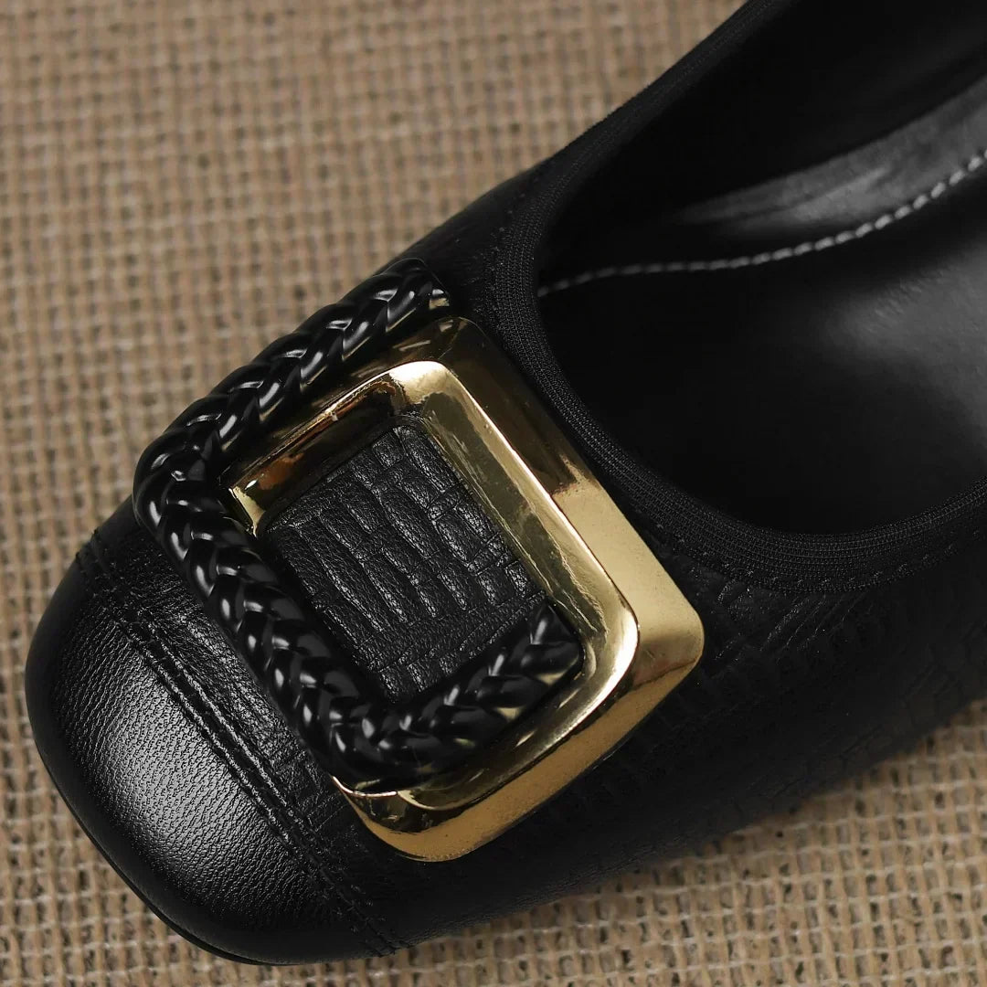 Novalisse heels in black, close-up of gold buckle detail