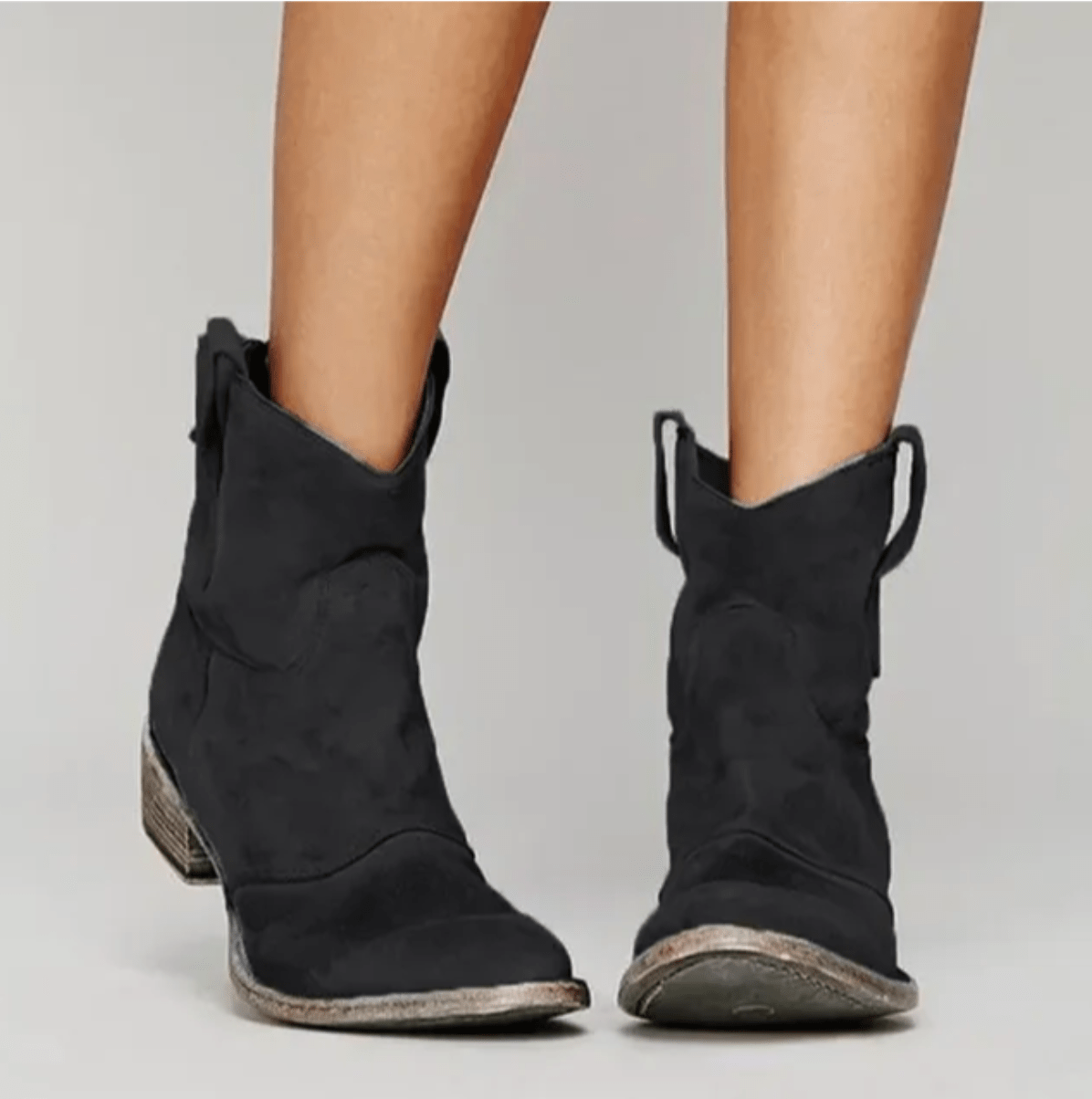 Piper western pull-on ankle boots in black, worn front view