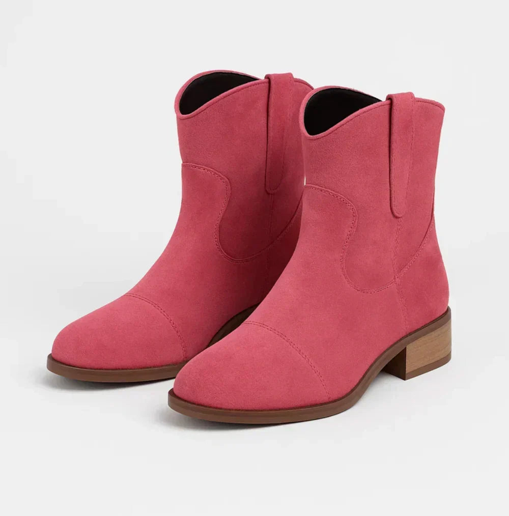 Suedellea Western ankle boots in pink, angled pair view