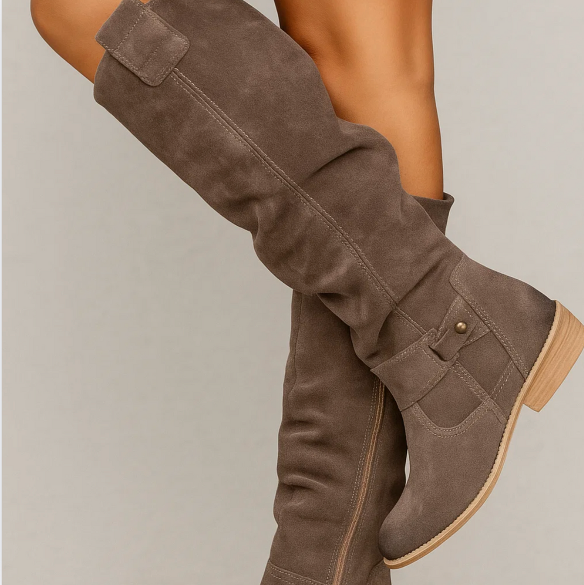 Coraline suede boots in dark brown worn, close-up of ankle strap