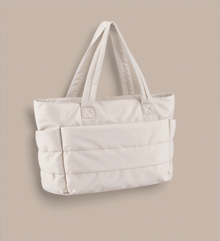 Calyss bubble shoulder bag in beige, three-quarter view