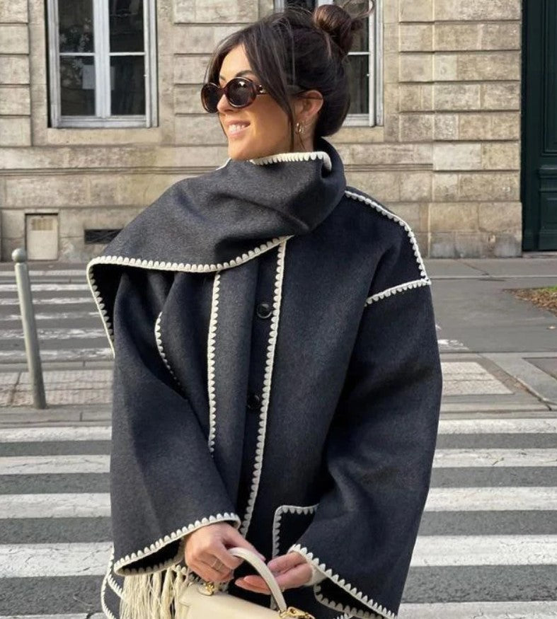 Zyra fringed scarf jacket in charcoal grey, side view on model outdoors