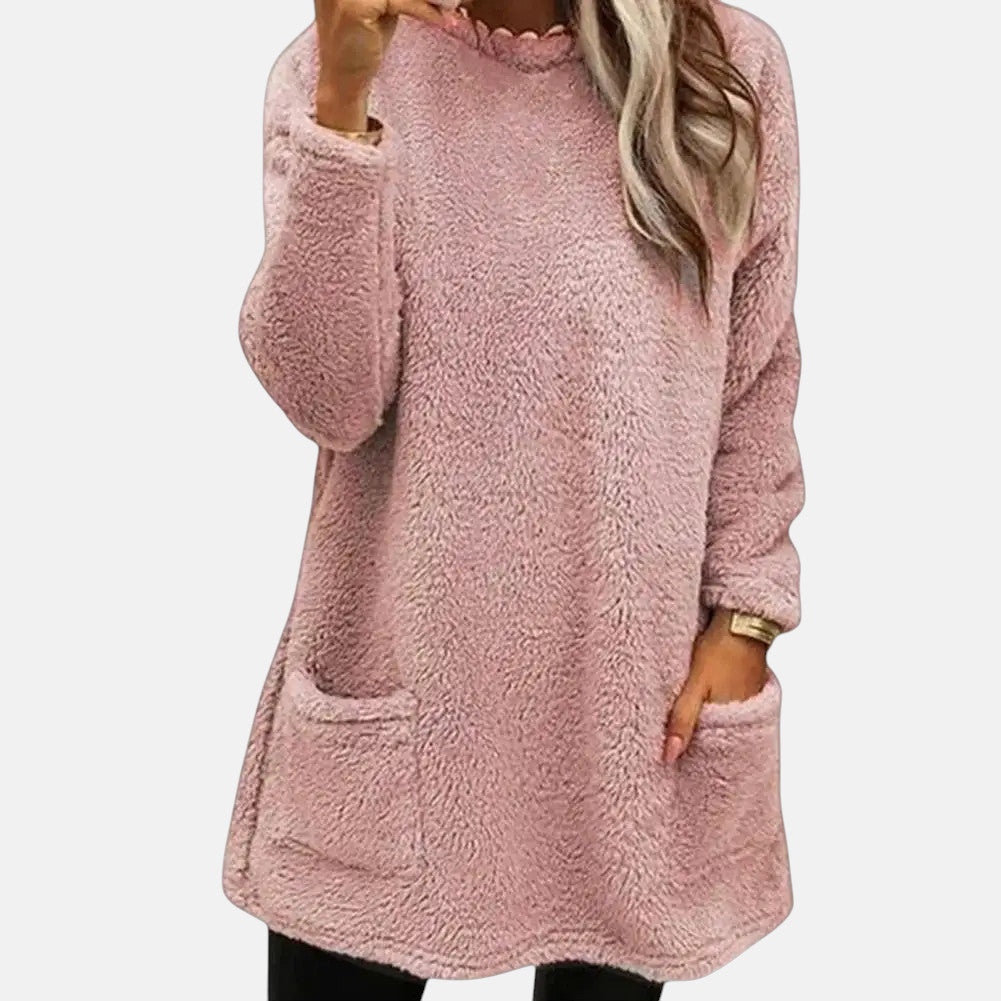 Emeris comfortable sweater in pink, front view worn with leggings