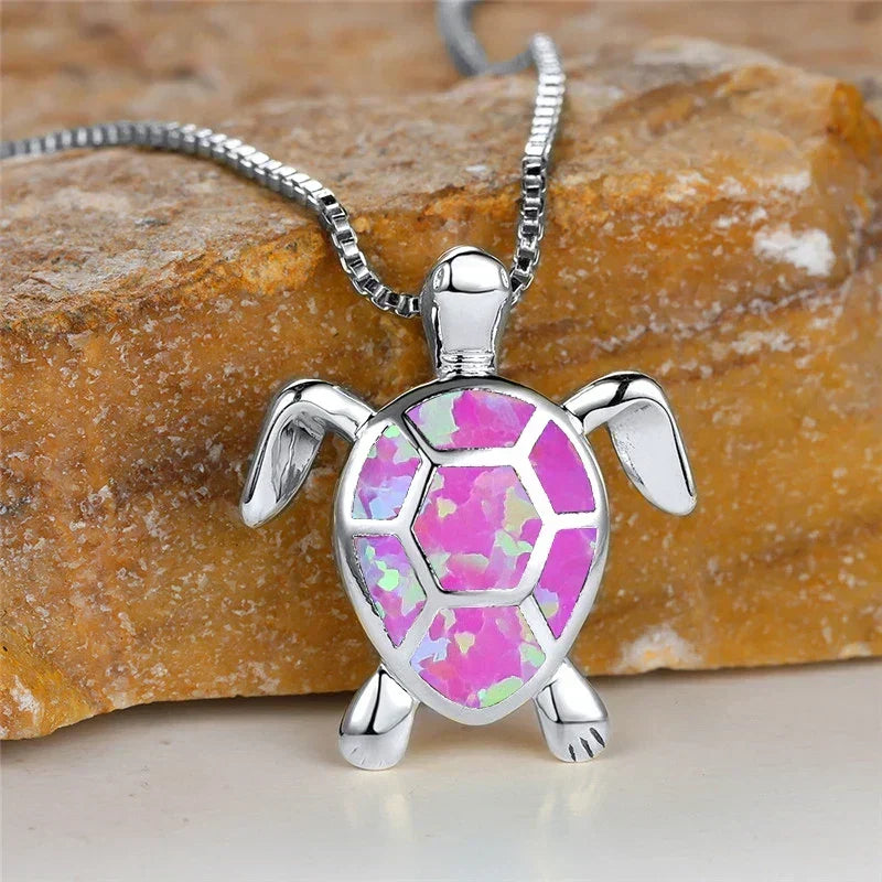Opal turtle pendant necklace in silver tone with pink shell panels