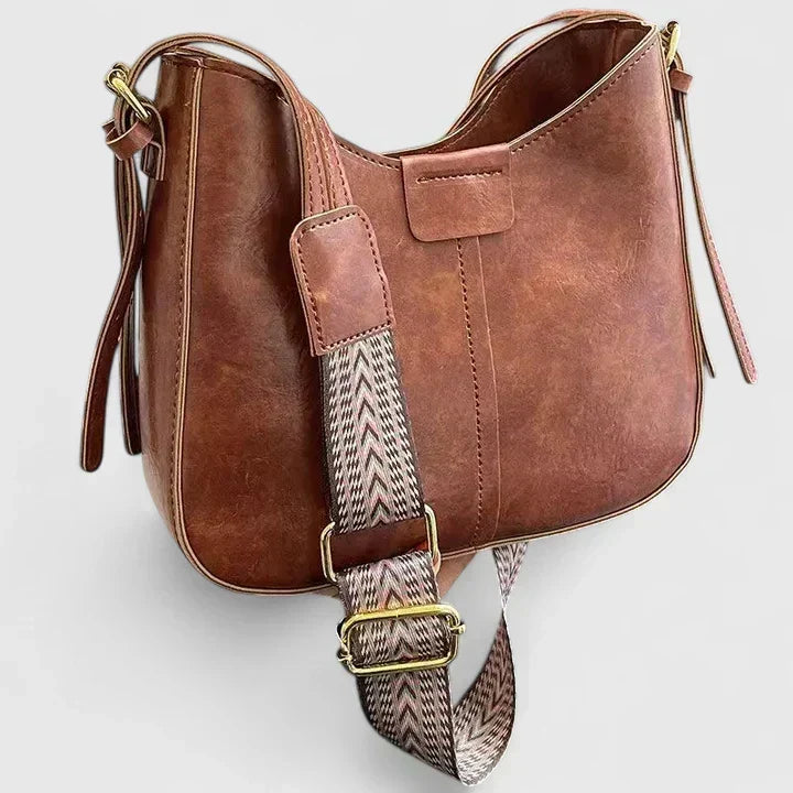 Verena shoulder bag in red brown showing gold-tone strap buckle