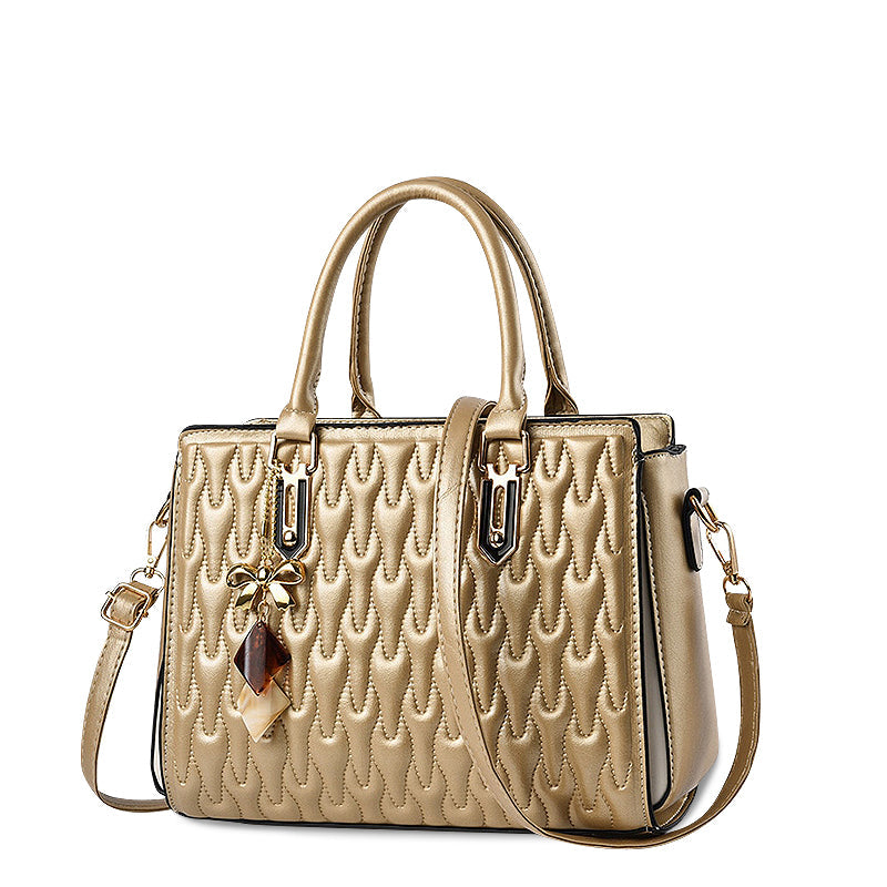 Vellora shoulder handbag in gold beige, angled front view