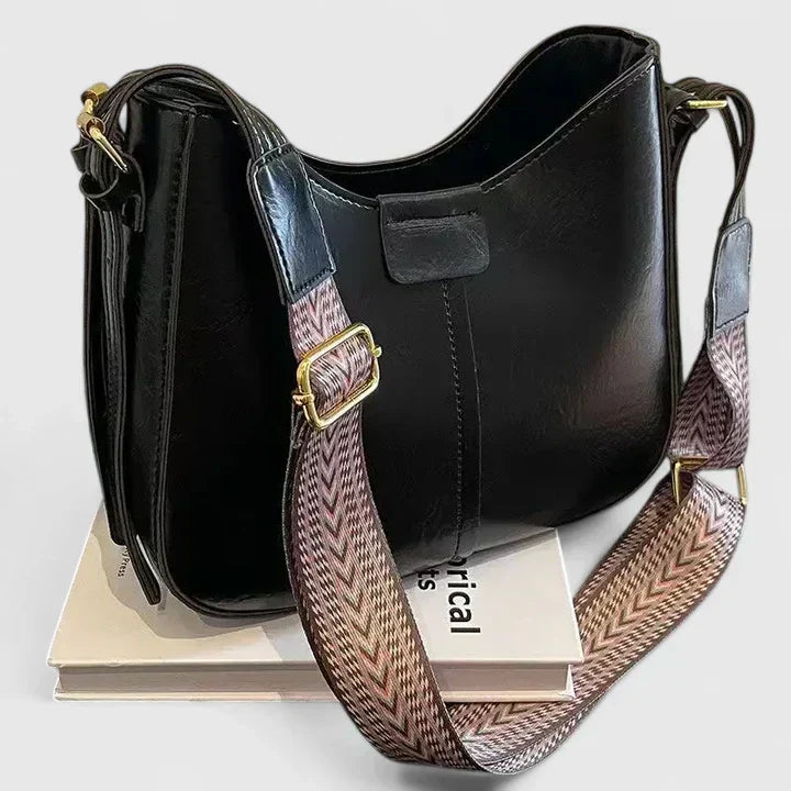 Verena shoulder bag in black with woven chevron strap, front view
