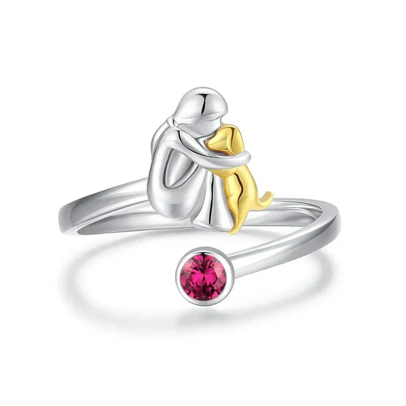Vesporra dog icon ring with pink gemstone, front view