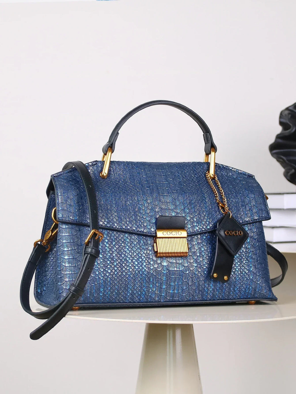 Selene python tote bag in royal blue with shoulder strap and charm