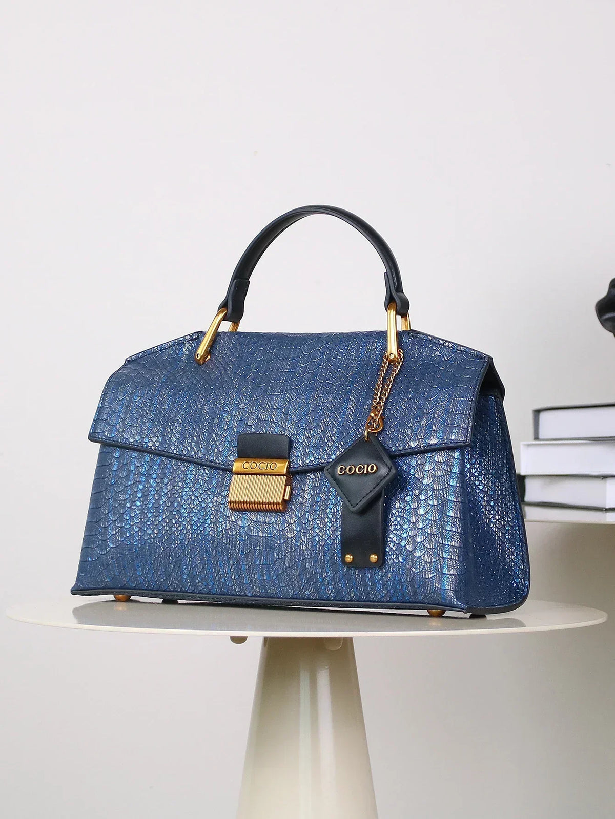 Selene python tote bag in royal blue, three-quarter side view