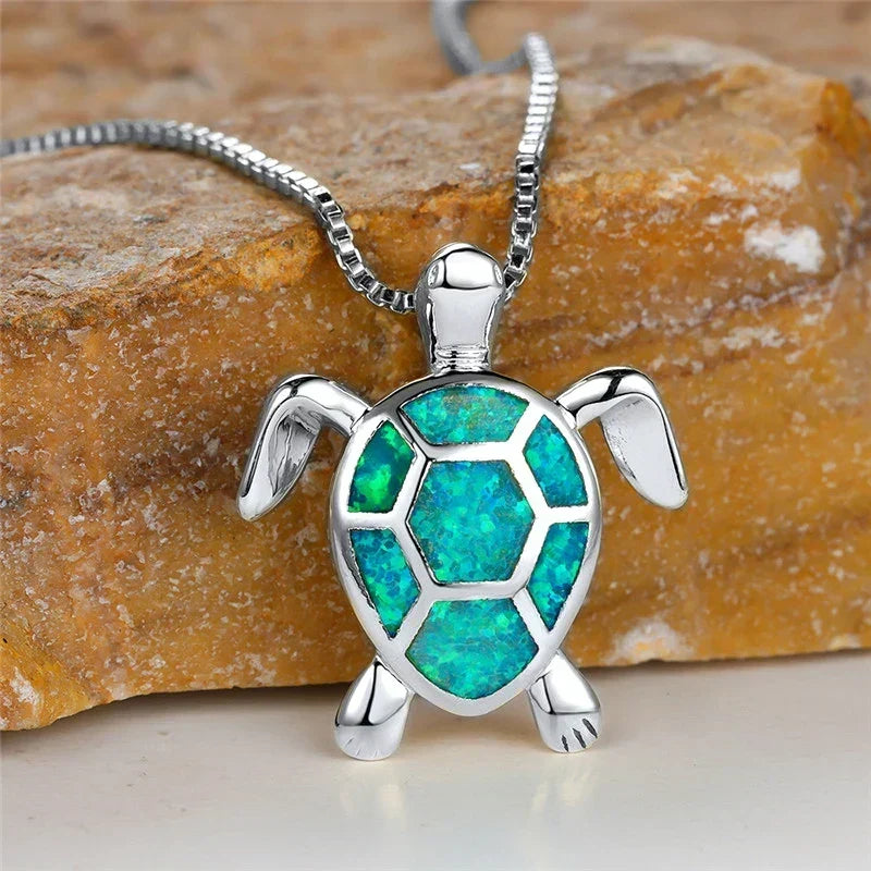 Opal turtle pendant necklace in silver tone with green shell panels
