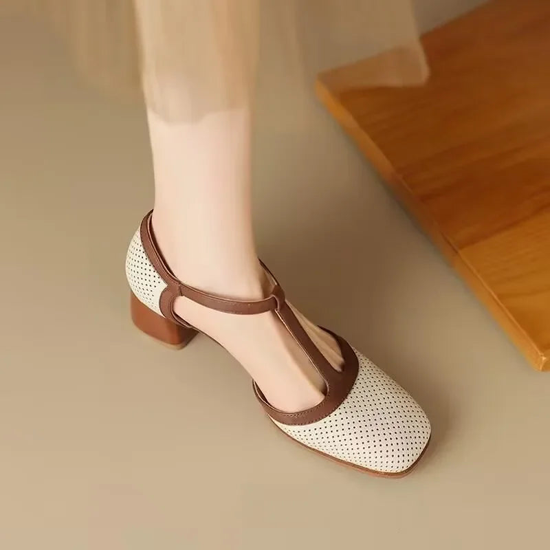 Genira mid-heel classic shoes in off-white worn with trousers, side view