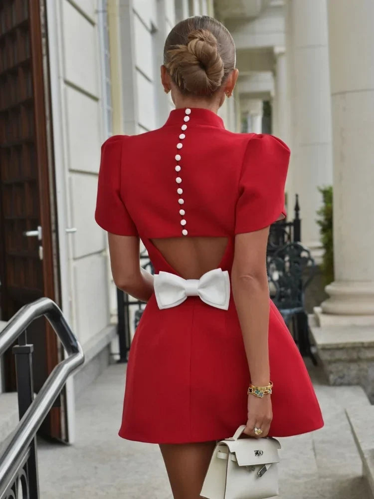 Laila skater dress in red, back view with buttons and white bow